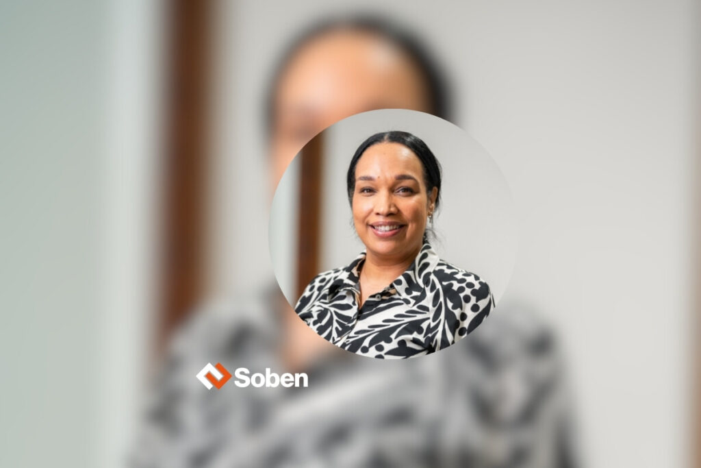 Headshot of Mary in a circle, soben logo at the left side, and as background Mary picture of focus.